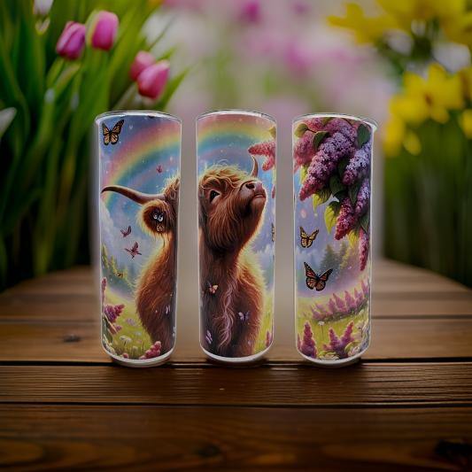 Highland cow with rainbow and butterflies