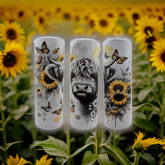 Black and White Highland Cow with Sunflowers