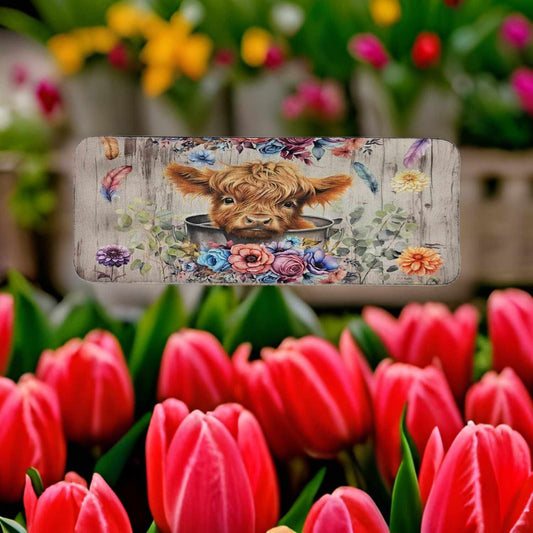 Cute Highland cow with flowers