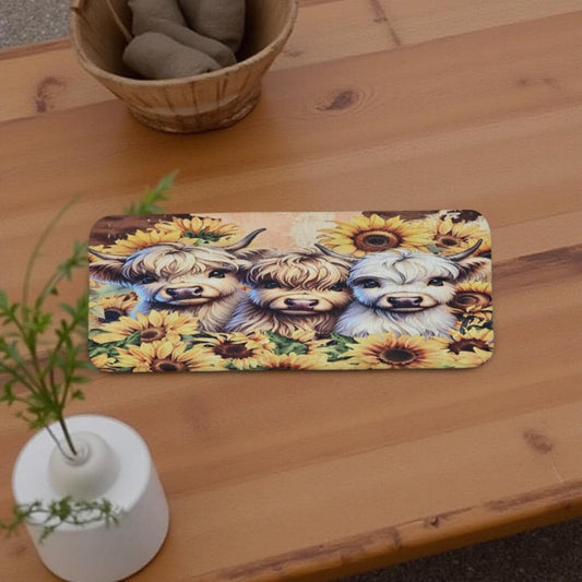 3 cute highland cows and sunflowers