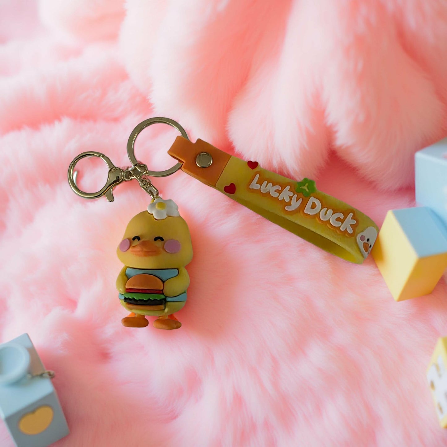 Lucky Duck holding a Burger