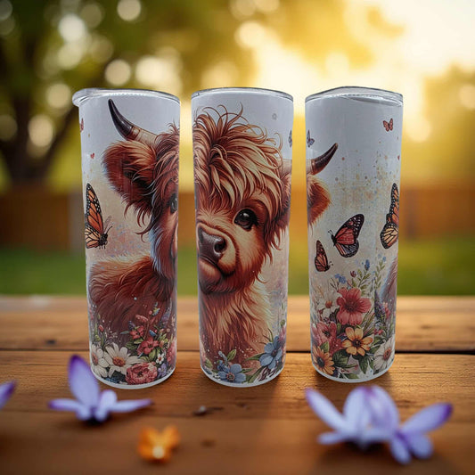 Gorgeous Highland cow with butterflies in the spring time