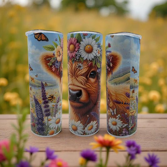 Highland Cow with flowers in the spring time