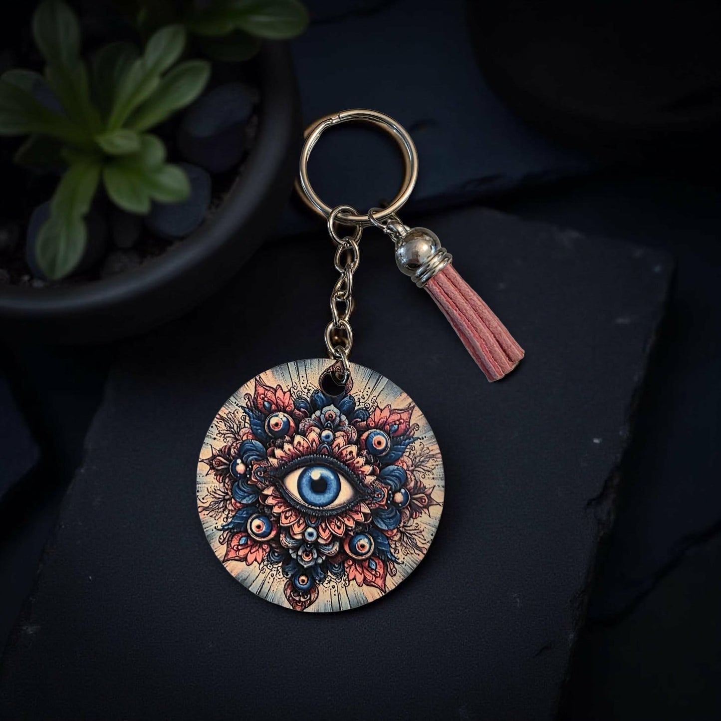 pink and blue evil eye