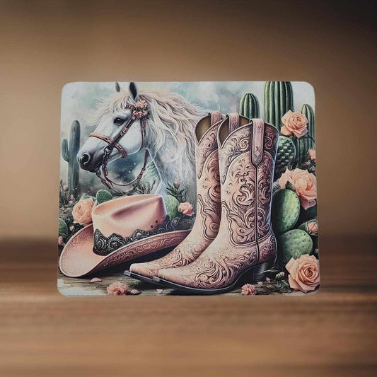 Pink cowgirl boots, hat and horse