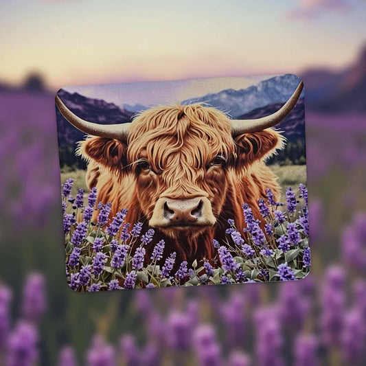 Highland cow with purple flowers